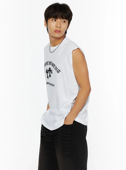 Men's Graphic Sleeveless Tee IL510 White side shot on male model hand in pocket showing sleeveless silhouette and partial cross graphic with chain necklace