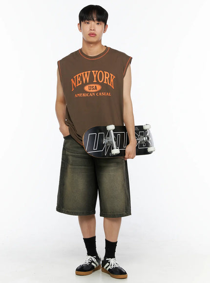 Men's Graphic Sleeveless Tee IL514 Dark green full-body front shot model holding skateboard under arm orange New York USA American Casual print