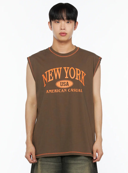 Men's Graphic Sleeveless Tee IL514 Dark green close-up front shot model cropped at chest orange New York USA American Casual arch graphic orange stitch