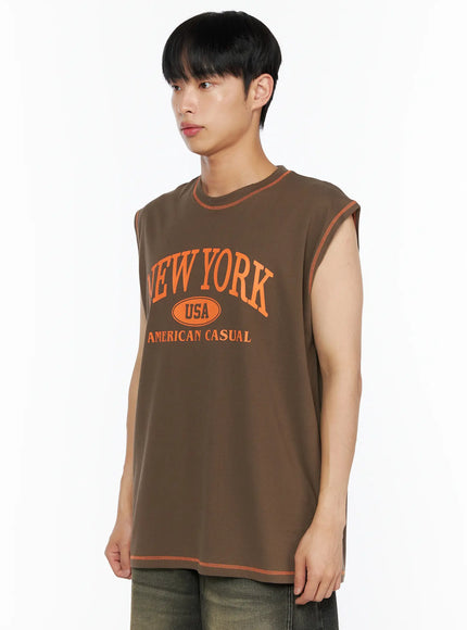 Men's Graphic Sleeveless Tee IL514 Dark green side shot model looking away orange contrast stitch armhole detail cotton fabric close view