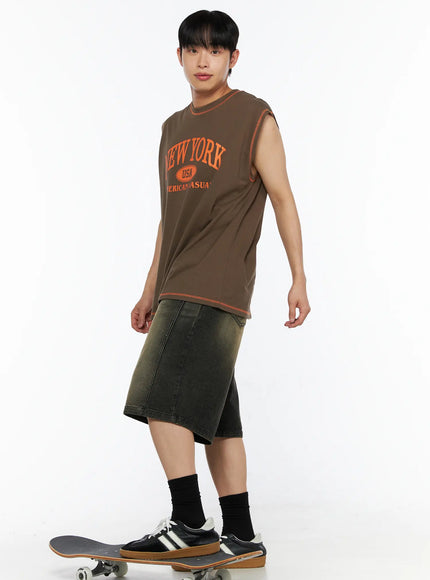 Men's Graphic Sleeveless Tee IL514 Dark green side angle full-body shot model on skateboard orange New York graphic visible relaxed fit