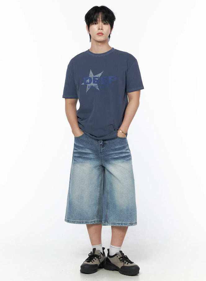 Men's Graphic Star T-Shirt IU523 Blue full-body front shot on male model, hands in pockets, styled with wide-leg denim shorts and chunky sneakers