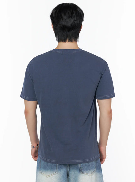 Men's Graphic Star T-Shirt IU523 Blue back shot on male model upper body, plain back panel with white contrast topstitching on neckline and hem