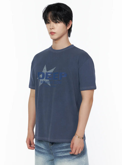 Men's Graphic Star T-Shirt IU523 Blue side shot on male model upper body, angled left, showing star graphic and white contrast stitching detail