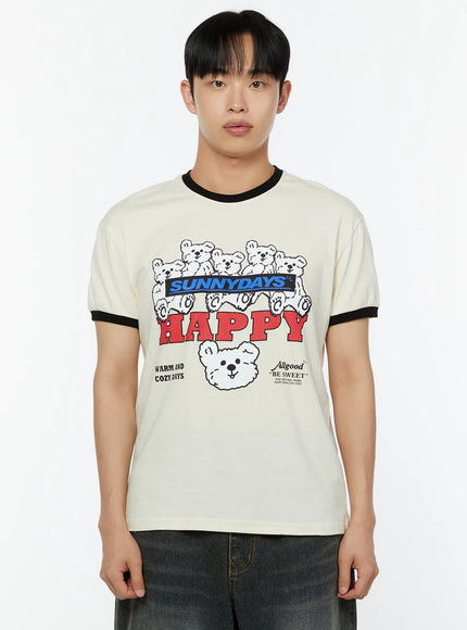 Men's Graphic T-Shirt IU529 Light beige close-up front crop on male model showing SUNNYDAYS HAPPY bear graphic Allgood BE SWEET text black ringer collar and cuff contrast detail