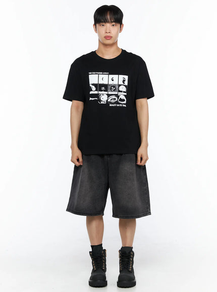 Men's Graphic Tee IL514 Black front full-body shot on male model styled with washed denim shorts and black lace-up boots