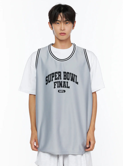 Men's Graphic Varsity Jersey IL515 Gray close-up front shot on male model from chest up, Super Bowl Final NFL black arch print and black-striped neckline clearly shown