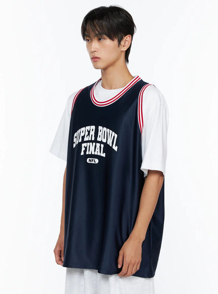 Men's Graphic Varsity Jersey IL515 Dark blue side shot on male model angled left, showing Super Bowl Final NFL graphic print and red-striped neckline detail