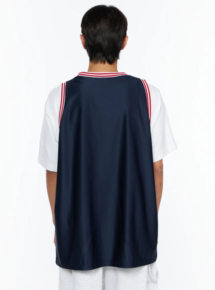 Men's Graphic Varsity Jersey IL515 Dark blue back shot on male model showing plain navy back panel, red-striped neckline, and white tee underneath