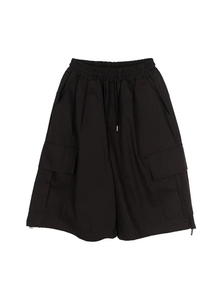 Men's Graphic Wide Jorts IL510 Black flat-lay back view showing CHANGE RULE white graphic print split across rear cargo pockets