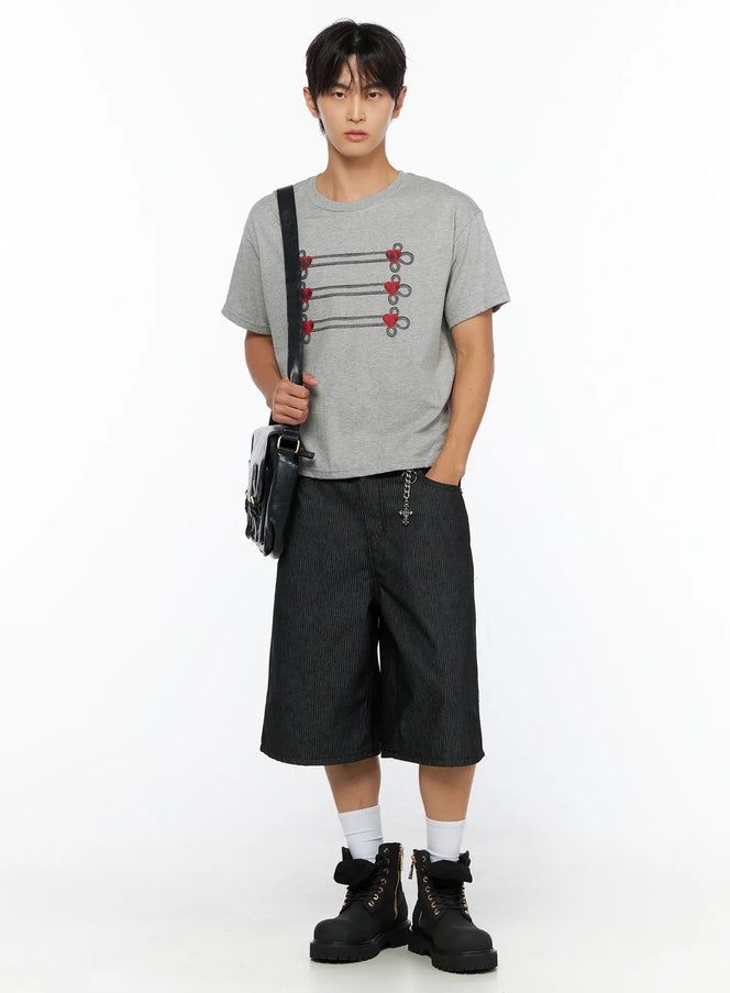 LEWKIN Men's Heart Graphic T-Shirt IL515 Gray full-body front shot on male model styled with black shorts cross chain bag and boots