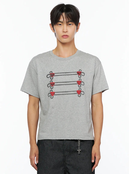 Men's Heart Graphic T-Shirt IL515 Gray close-up front shot on male model cropped to torso showing six red heart loop graphic details clearly