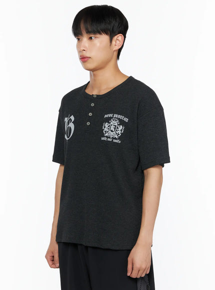 Men's Henley Waffle Tee IL514 Charcoal side shot on male model looking left showing henley button placket and waffle knit fabric texture detail