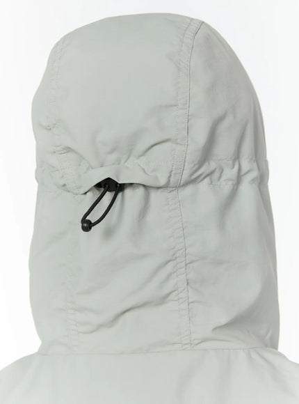 Men's Hooded Zip-Up Vest IL513 Gray close-up detail of back hood with black cord lock toggle on smooth gray nylon shell