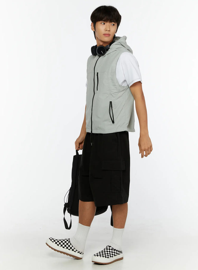LEWKIN Men's Hooded Zip-Up Vest IL513 Gray side shot on male model walking with backpack and headphones styled with black cargo shorts