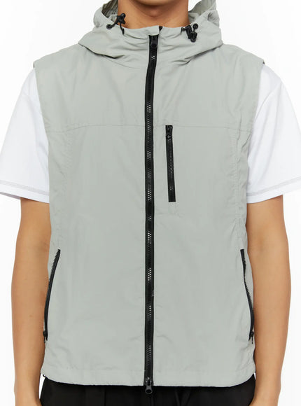 Men's Hooded Zip-Up Vest IL513 Gray cropped front shot on male model showing full zip chest pocket and dual side zip pockets with hood