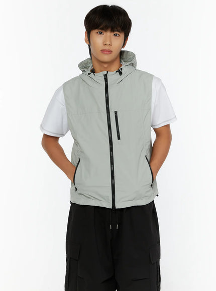 Men's Hooded Zip-Up Vest IL513 Gray front shot on male model hands in pockets showing center zipper and chest zip pocket detail