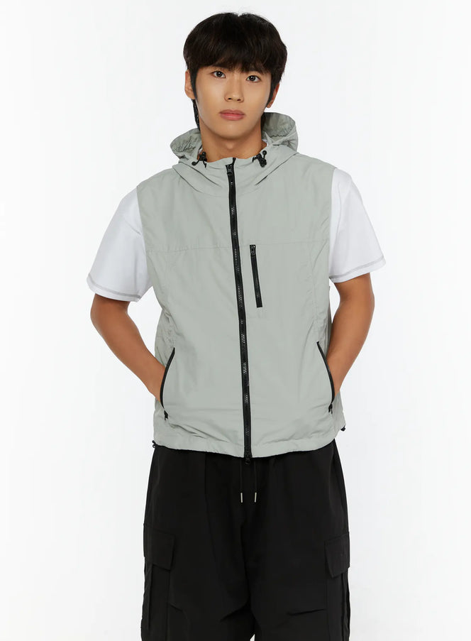 Men's Hooded Zip-Up Vest IL513 Gray front shot on male model hands in pockets showing center zipper and chest zip pocket detail