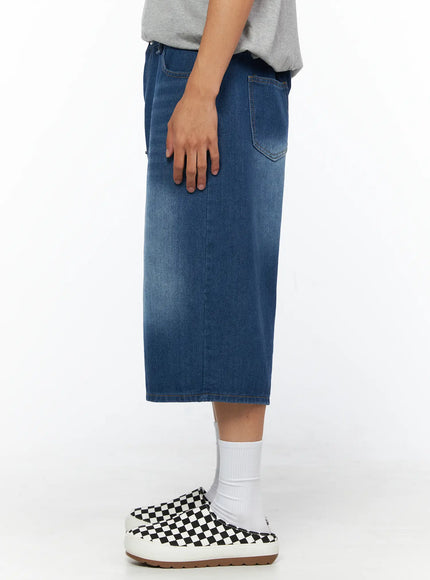 Men's Keyring Detail Jorts IL515 blue side shot on model showing exaggerated wide-leg cropped length washed denim fabric and back patch pocket profile