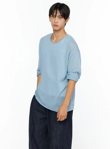 LEWKIN Men's Knit Long Sleeve T-Shirt IL528 Sky Blue three-quarter shot on male model angled pose with sleeves rolled up styled with wide-leg dark trousers sheer lightweight knit