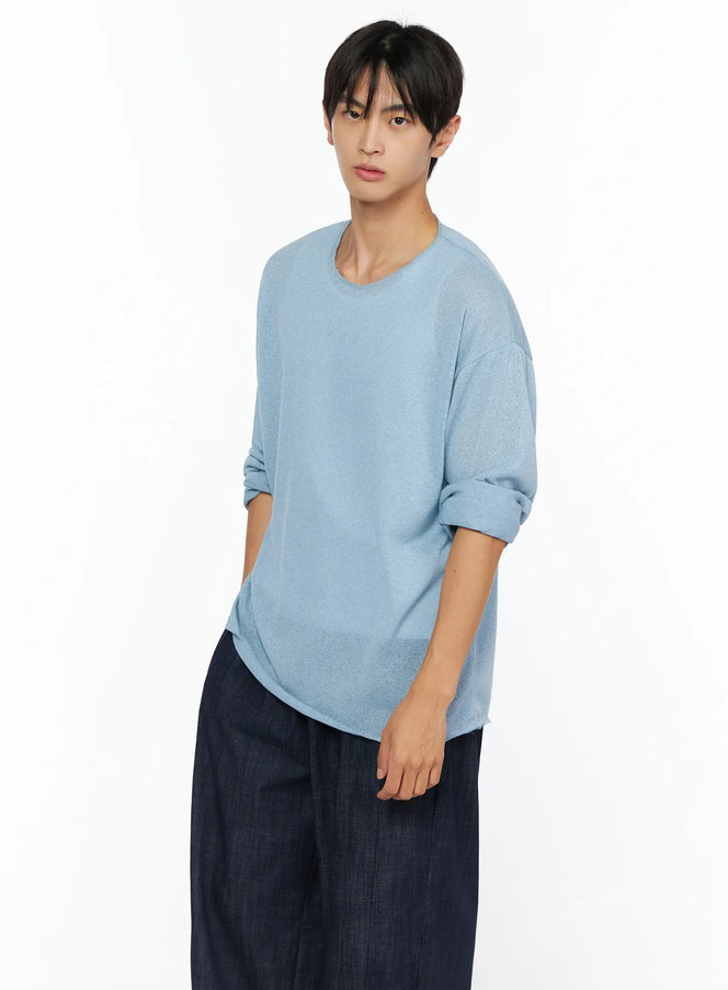 LEWKIN Men's Knit Long Sleeve T-Shirt IL528 Sky Blue three-quarter shot on male model angled pose with sleeves rolled up styled with wide-leg dark trousers sheer lightweight knit