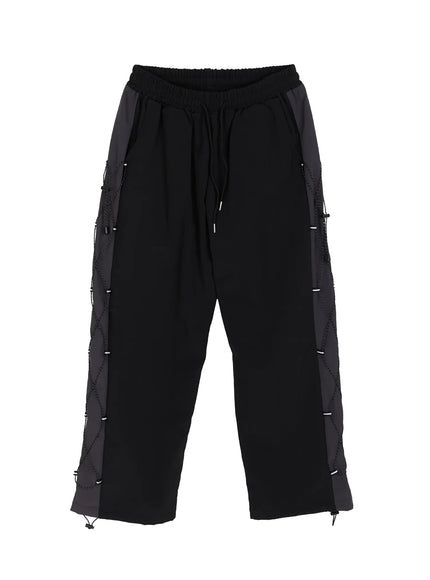 Men's Lace-Up Track Pants (Black) IL514 Black flat-lay front view showing full silhouette, elastic drawstring waistband, dual-tone side panels, and diamond lace-up cord detail
