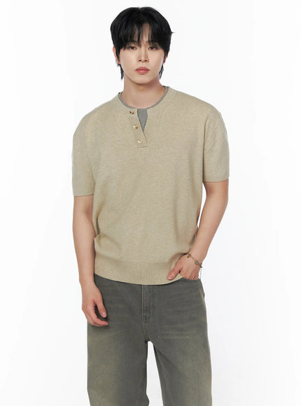 Men's Layered Henley Neck Knit Tee IL502 Beige cropped front shot on male model showcasing gray contrast ribbed neckline three gold henley buttons and fine knit fabric texture