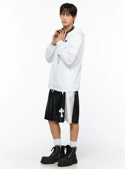 Men's Lightweight Windbreaker Jacket IL515 White three-quarter side shot on male model hands at sides showing jacket silhouette and black shorts styling