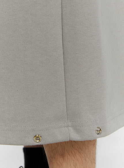 Men's Logo Embroidered Snap Hem Bermuda Sweat Shorts (Gray) IL507 gray close-up detail of silver snap buttons at hem corner and cotton fabric texture