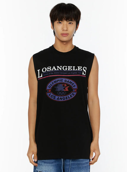 Men's Los Angeles Print Tank IL509 Black front shot on male model showing full LOSANGELES Olympic Games graphic and sleeveless silhouette with blue denim