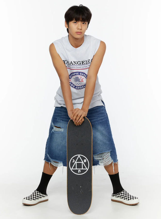 LEWKIN Men's Los Angeles Print Tank IL509 Light gray size M/L front shot on male model leaning on skateboard with ripped denim shorts