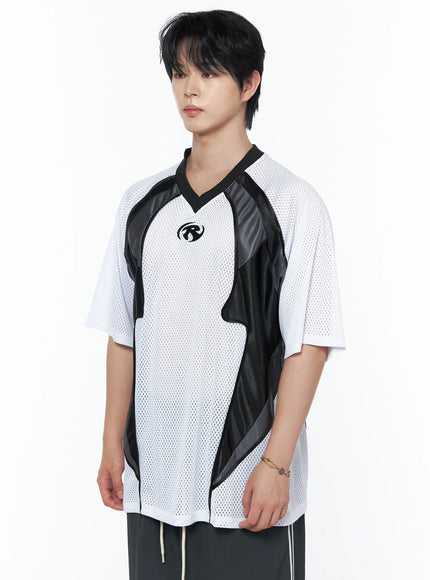 Men's Mesh Contrast V-Neck T-Shirt IU523 White three-quarter front shot on male model showing black contrast panel detail and chest logo with dark trousers