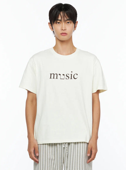 Men's Music Print T-Shirt IL515 ivory front close-up shot male model upper body showing music typographic chest graphic on cream cotton crew neck tee