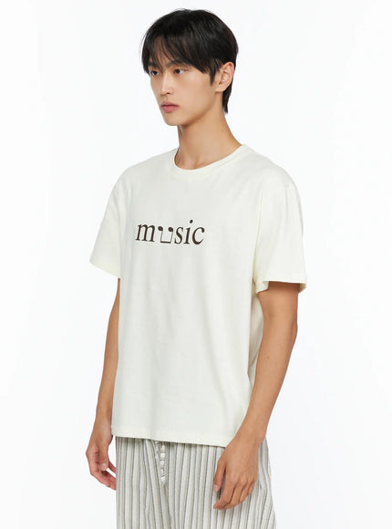 Men's Music Print T-Shirt IL515 ivory side shot male model showing graphic music print crew neck short sleeve relaxed fit upper body close-up