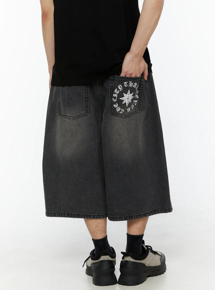 Men's 'Never Stop' Graphic Bermuda Jorts (Dark Gray) IL507 back close-up on model showing star and circular old English text print on right back pocket