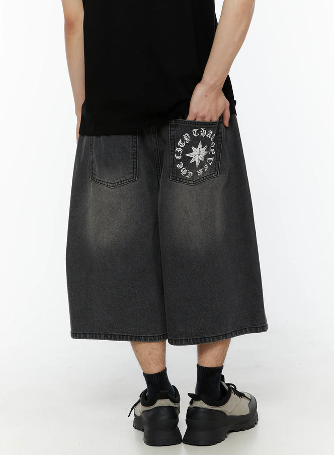 Men's 'Never Stop' Graphic Bermuda Jorts (Dark Gray) IL507 back close-up on model showing star and circular old English text print on right back pocket