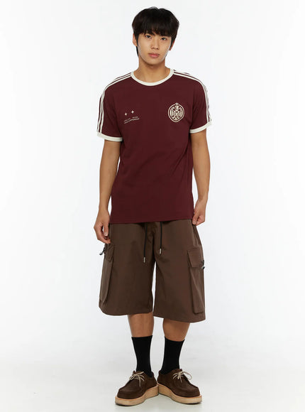Men's Nylon Cargo Drawstring Bermuda Shorts (Dark Brown) IL507 Dark brown front full-length on male model in burgundy tee, hands at sides, styled with brown suede moc-toe shoes