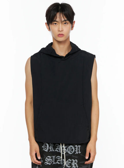 Men's Nylon Hooded Vest IL520 Black front half-body shot on male model standing straight, showing structured hood and kangaroo pocket