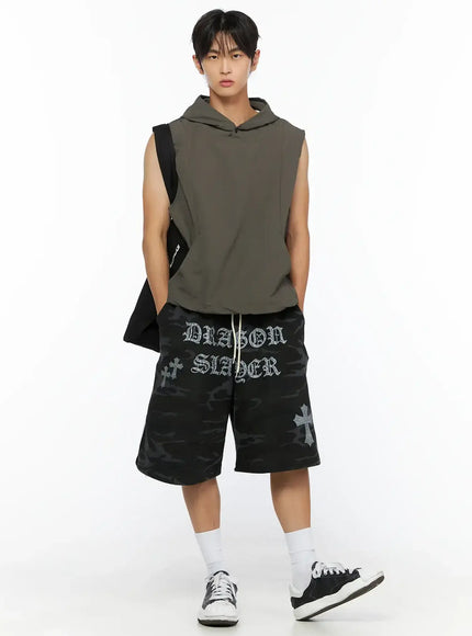 LEWKIN Men's Nylon Hooded Vest IL520 Dark green full-body front shot on male model styled with camo shorts and black bag, S/M