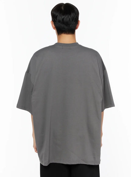 Men's Oversized Athletic Tee IL514 Gray back shot on male model showing plain oversized silhouette, dropped shoulders and clean stitching on gray cotton fabric