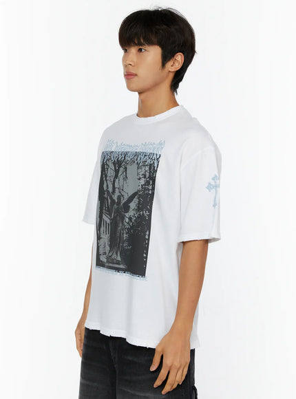 Men's Oversized Graphic T-Shirt IL513 White side model shot showing angel statue chest graphic blue cross sleeve print and raw cut hem detail