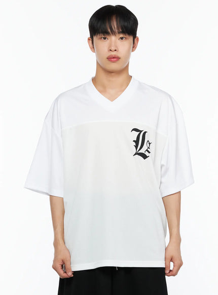 Men's Oversized Mesh Rugby Tee IL514 White front close-up bust shot on male model, black old-english La gothic logo on chest mesh panel, V-neck collar detail visible