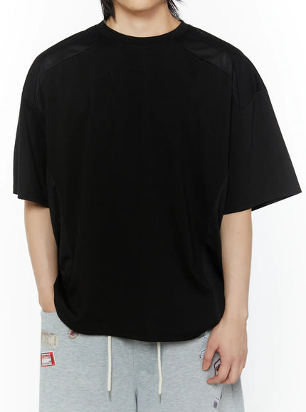 LEWKIN Men's Oversized Mesh Tee (Black) IL509 front view on male model wearing gray drawstring shorts with perforated mesh shoulder panel detail