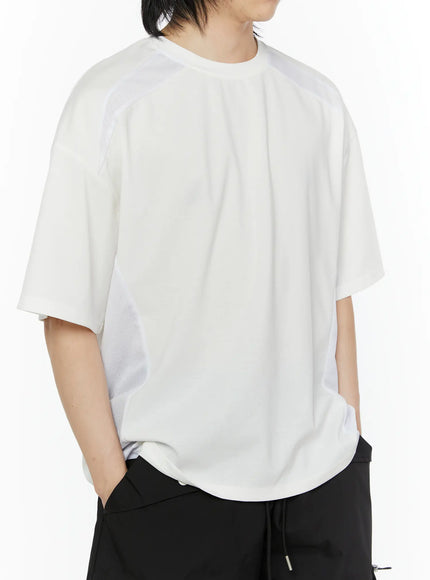 LEWKIN Men's Oversized Mesh Tee (White) IL509 white angled front shot on male model hand in pocket styled with black cargo shorts