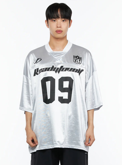 Men's Oversized Sports Jersey Tee IL514 Silver cropped front shot on male model showing Readytoovolt 09 graphic V-neck collar and VLT shield badge detail