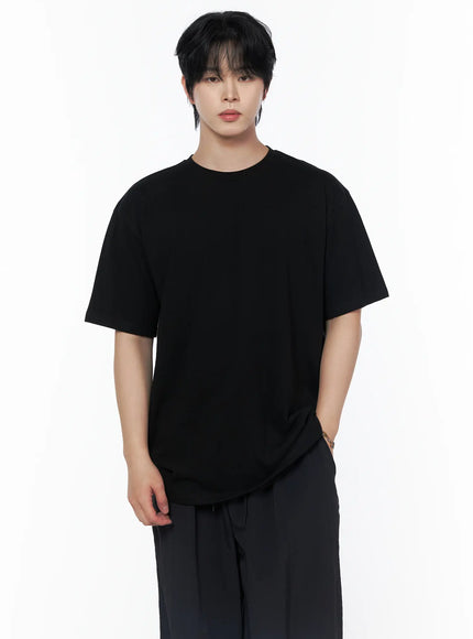 Men's Oversized Studded Tee IL502 Black front crop shot on male model upper-body showing round neck oversized cotton tee with dropped shoulders