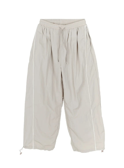 Men's Oversized Sweatpants IL510 Light gray flat-lay front view showing elastic drawstring waist, white side piping, wide balloon leg, and hem drawcord toggles