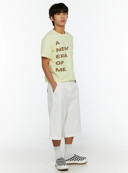 Men's Patch Pocket Jorts IL515 White three-quarter front view on model with hands in pockets, styled with graphic yellow tee and checkered shoes