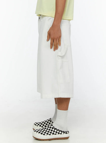 Men's Patch Pocket Jorts IL515 White pure side view on model showing cargo pocket depth, cuffed hem, and cotton twill fabric texture