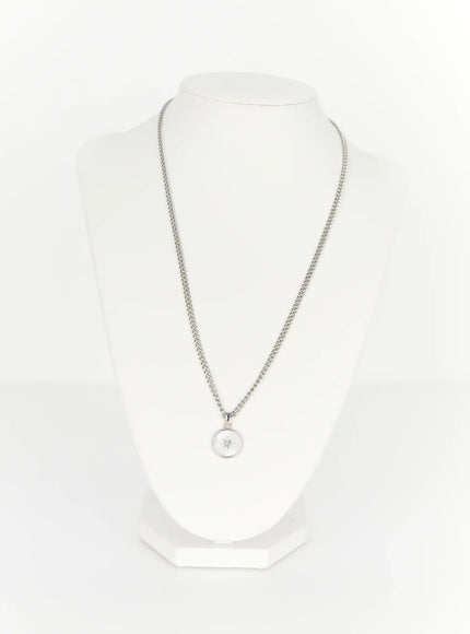 Men's Pendant Necklace IL510 Silver display stand shot showing full silver curb chain length with round mother-of-pearl north star medallion pendant on white bust